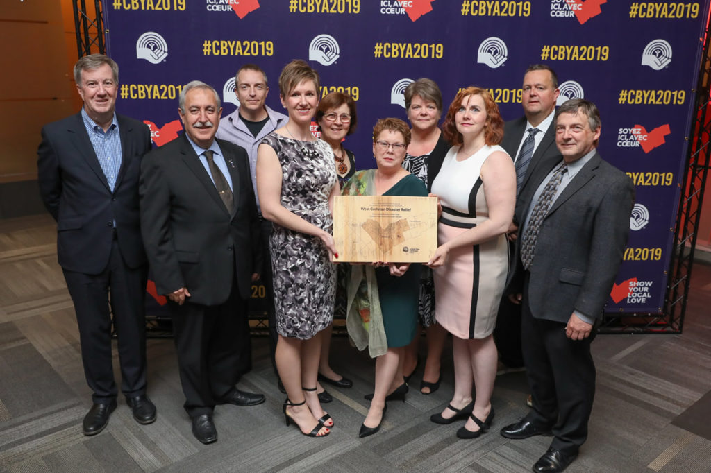 A photo of the Trend-Arlington Community Association and West Carleton Disaster Relief with their award at the CBYA Gala.